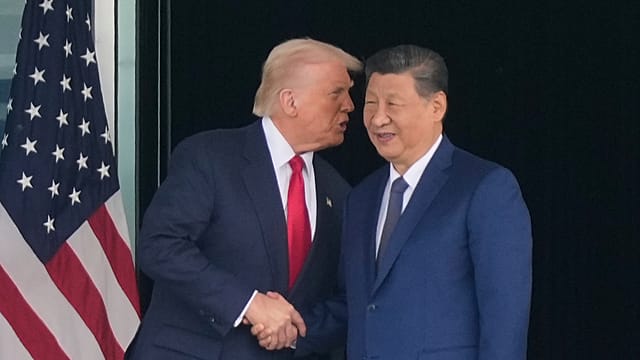 Trump, Xi meet in person as US and China move to ease trade tensions