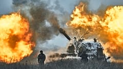 FILE: A self-propelled artillery vehicle fires on the frontline, Donetsk region, Ukraine, Saturday, Feb. 18, 2023. 