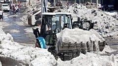 A truck carries ice as it cleans the street after a heavy storm of rain and hail which affected some areas of the city in ​​Guadalajara