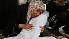 FILE - Palestinians mourn relatives killed in the Israeli bombardment on Rafah, Gaza Strip, Thursday, Dec. 7, 2023. 