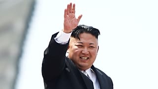 File photo: Kim Jong Un waves to crowds at a military parade in Pyongyang