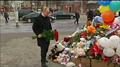 Vladimir Putin visits scene of Siberian shopping mall fire