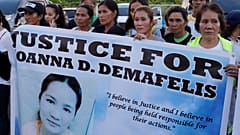 Residents display placards Joanna Demafelis