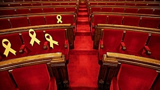 Ribbons on seats of imprisoned deputies at Catalonia’s parliament, March 24