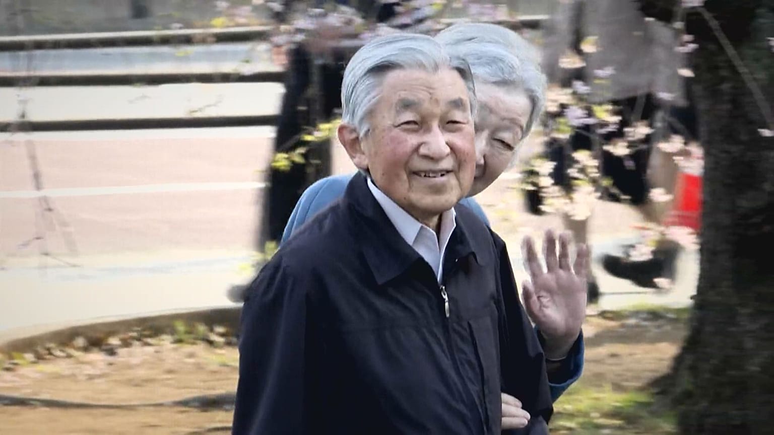 Japan`'s  Emperor and Empress enjoying cherry blossoms