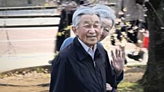 Japan`'s  Emperor and Empress enjoying cherry blossoms