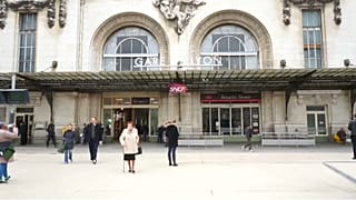 Paris suburban line passengers enter train through windows