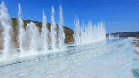 Ice-breaking detonations create spectacular scene on northeast China river