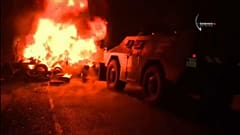 Armoured cars were sent to remove barricades blocking access to the camp