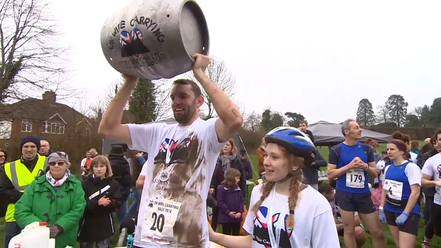 UK Wife-Carrying champion Chris Hepworth celebrates with Tanisha Prince.