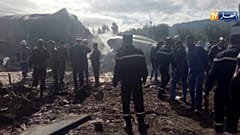 Rescuers at the scene of the crashed military aircraft