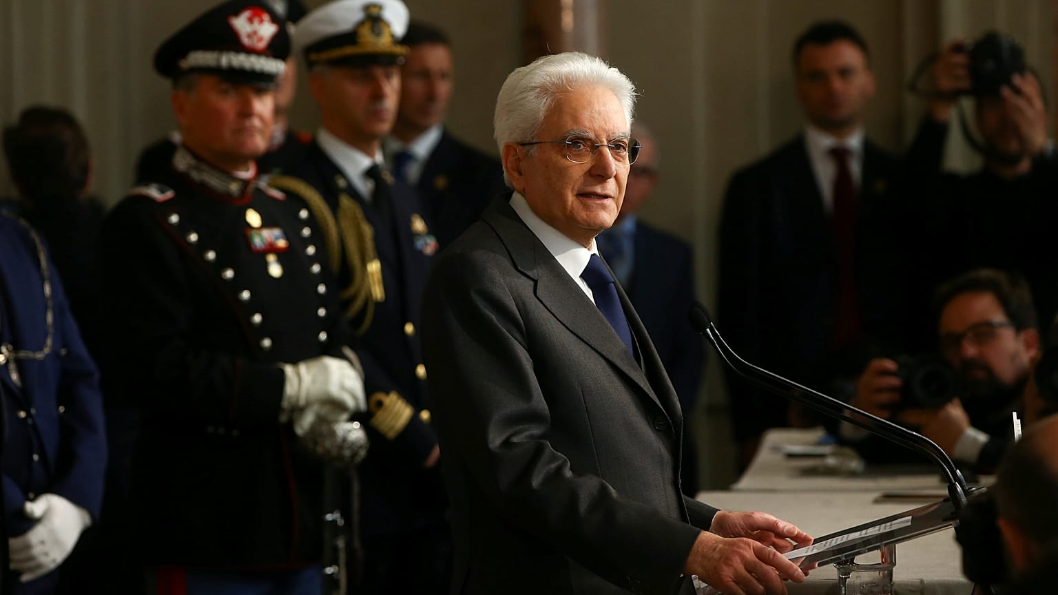 Italy's President Sergio Mattarella speaks to reporters
