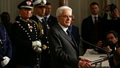 Italy's President Sergio Mattarella speaks to reporters