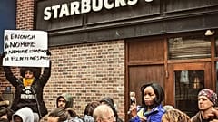 Starbucks apologises amid 'racial profiling' row