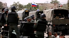 Russian flag is seen on military vehicle at entrance of Wafideen camp in Da