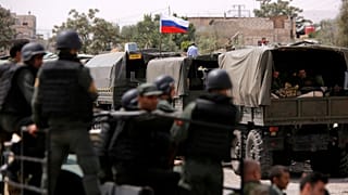 Russian flag is seen on military vehicle at entrance of Wafideen camp in Da
