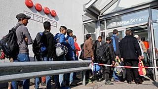 Migrants queue in Berlin (October 2015)