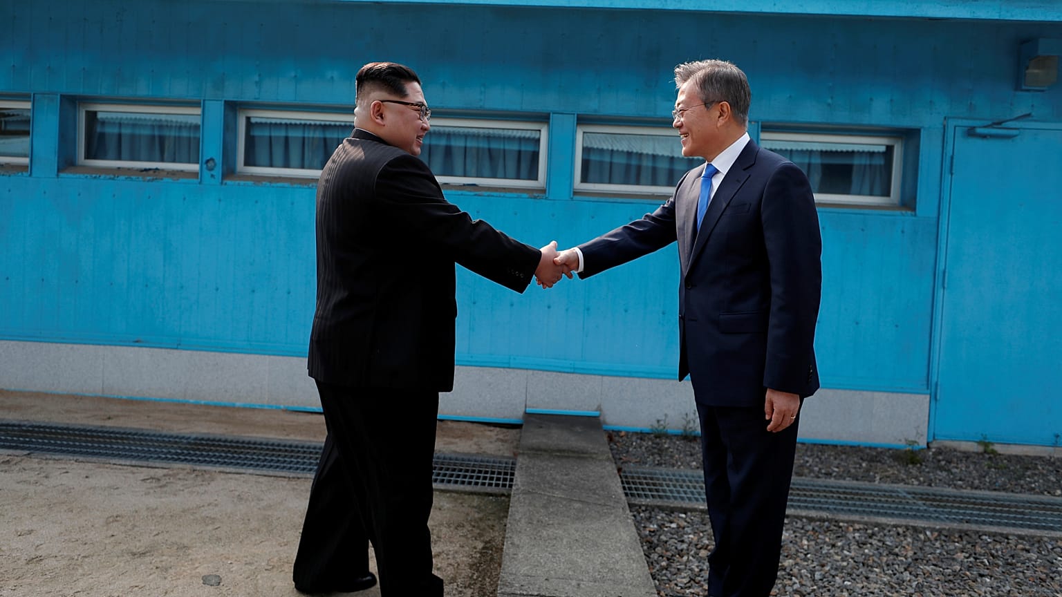 Kim Jong Un and Moon Jae-In shake hands over the border in April 2018