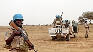 FILE PHOTO: UN peacekeepers stand guard in Kouroume, Mali, in May, 2015.