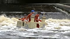 stream of floats of all shapes glide down the Fyris River
