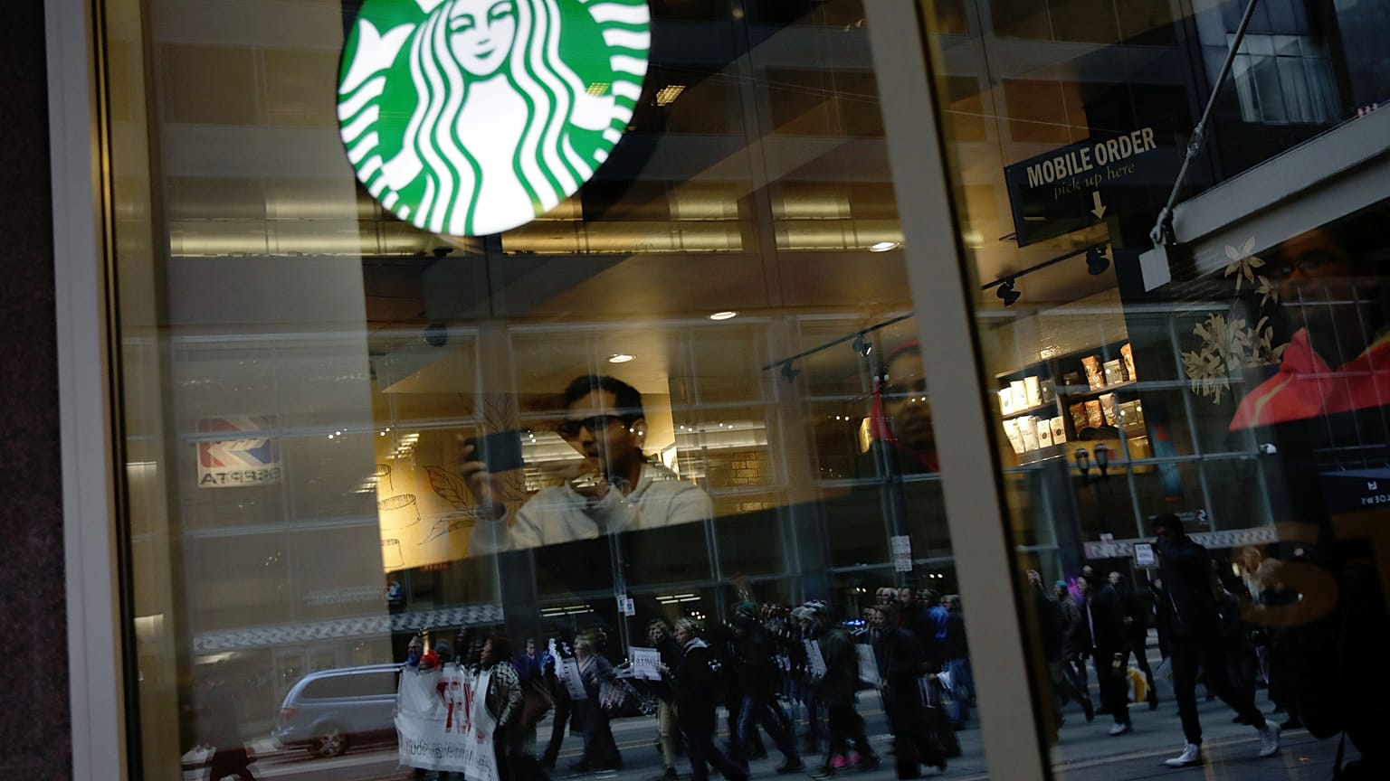 Black men arrested at Starbucks settle for $1 each and $200,000 programme 