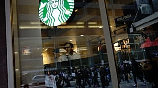 Black men arrested at Starbucks settle for $1 each and $200,000 programme