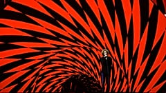 Michael Schulte singt beim ESC-Semifinale vor rot-schwarzem Hintergrund