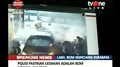 Indonesian police say sucide bombing family attacks Surabaya police headquarters