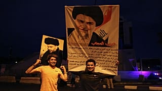 portraits of Shi'ite cleric Moqtada al-Sadr