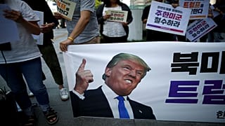 University students attend a protest against Donald Trump 