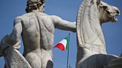 The Italian flag waves over the Quirinal Palace in Rome