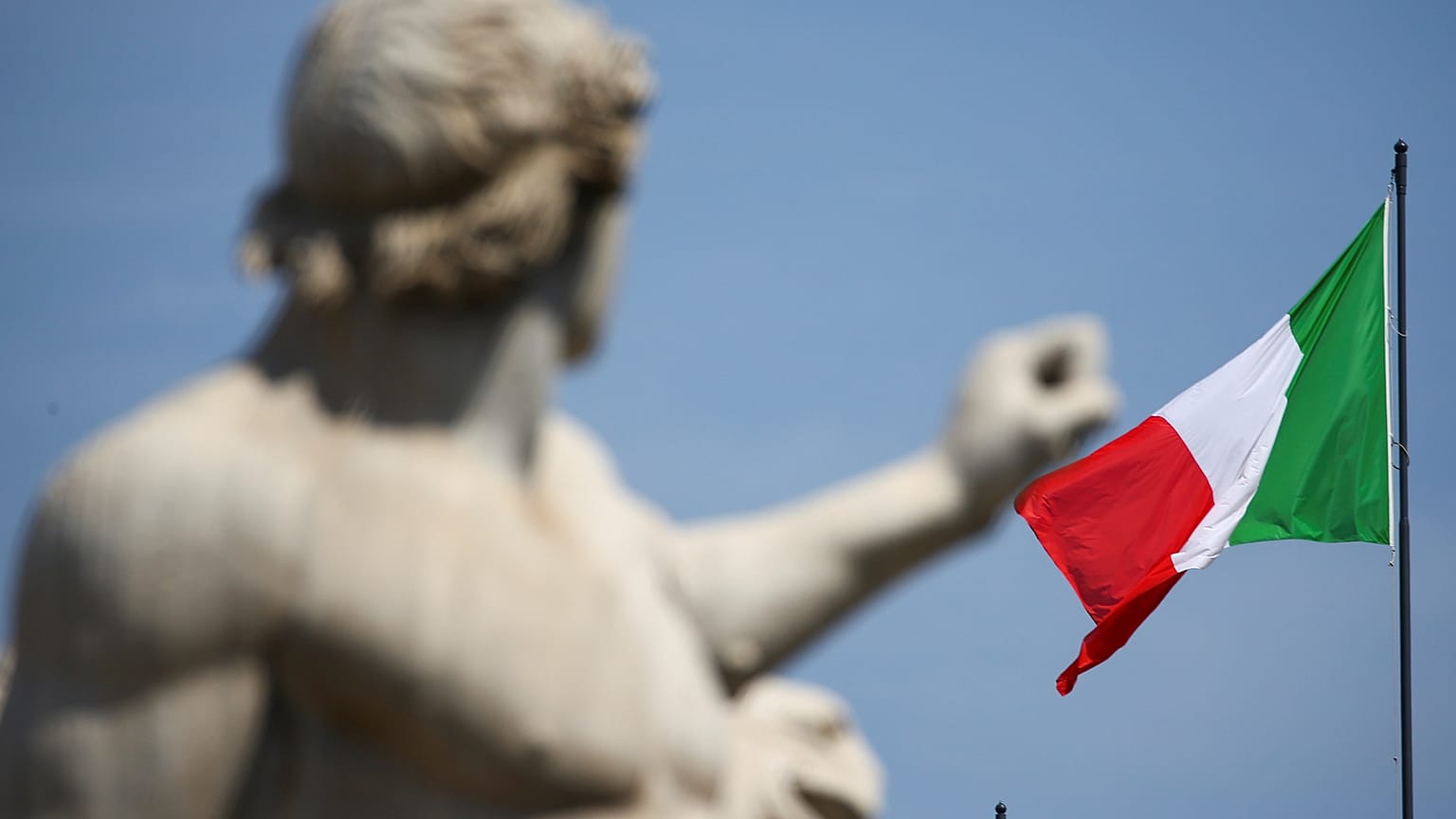 The Italian flag waves over the Quirinal Palace in Rome