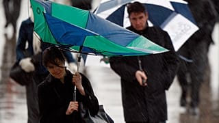 Torrential rain and thunderstorms cause 'travel chaos' in UK
