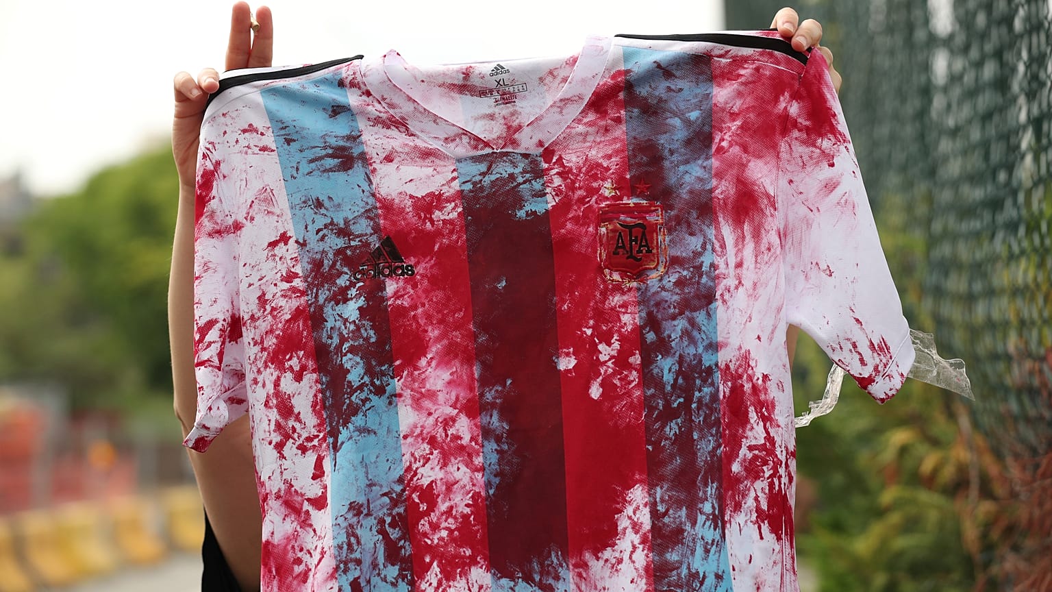 A protestor outside Argentina's training camp before the announcement