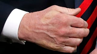 Trump shakes hands with France's President Macron