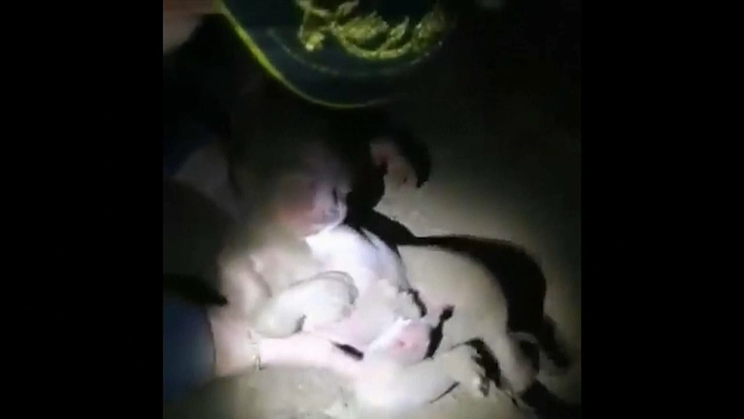 Brazilian police pull the baby girl from the soil