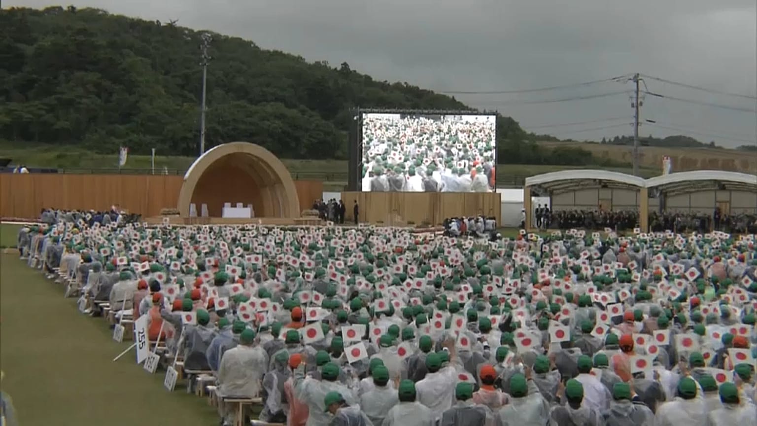 Japan's Emperor and Empress plant trees at Fukushima