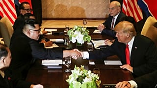 Donald Trump shakes hands with North Korea's leader