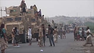Coalition ground forces mass on the outskirts of Hodeida.