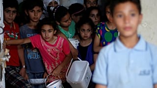 Benetton criticised for using pictures of migrants in adverts