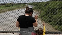 A Honduran mother and daughter seeking asylum wait on the Mexican side of t