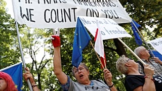 Demonstrators rally during meeting of Polish PM and EC's Frans Timmermans