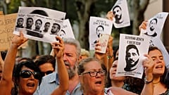Posters shame 'Wolf Pack' assailants as they return home