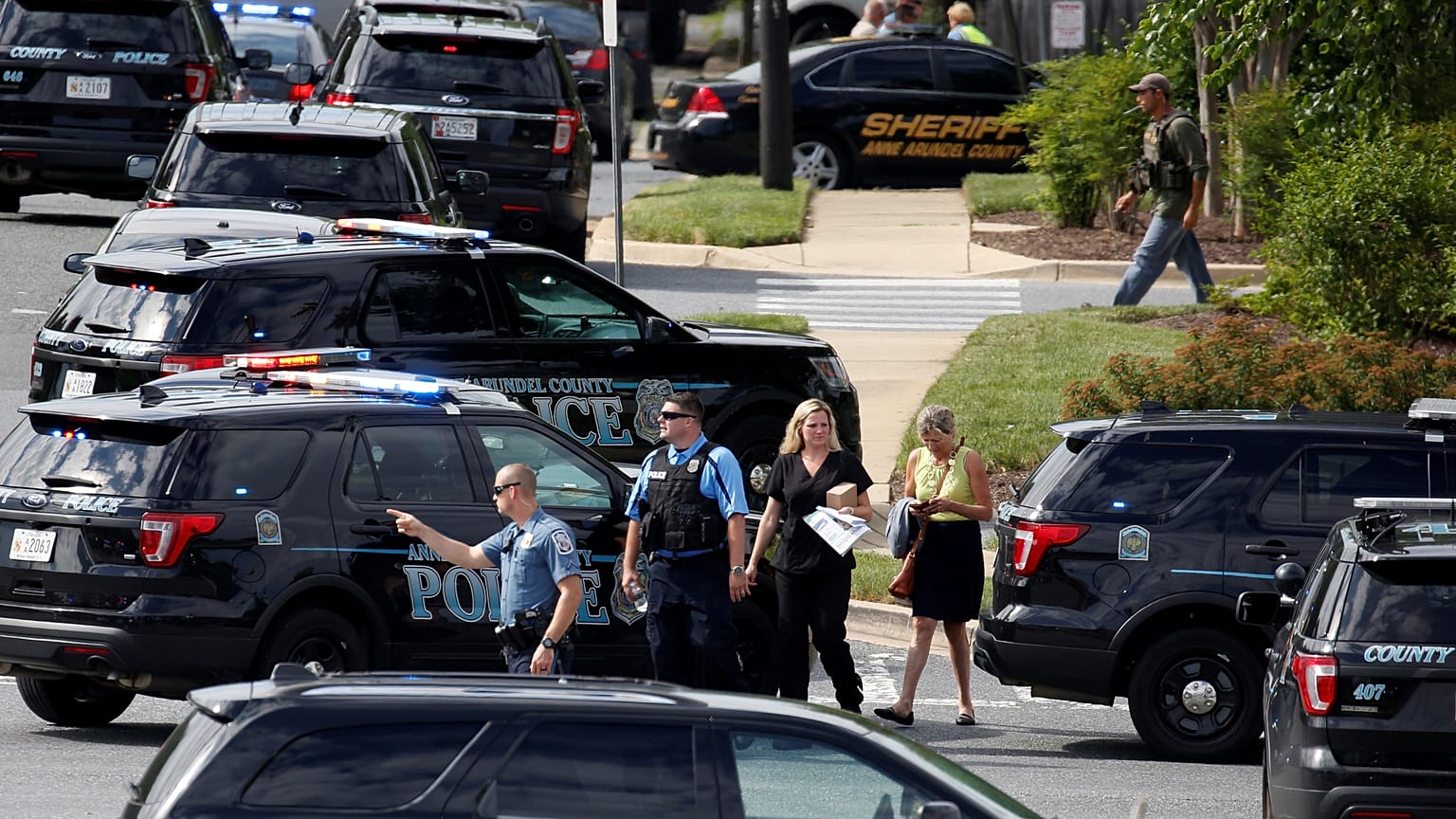 Police outside the offices of the newspaper