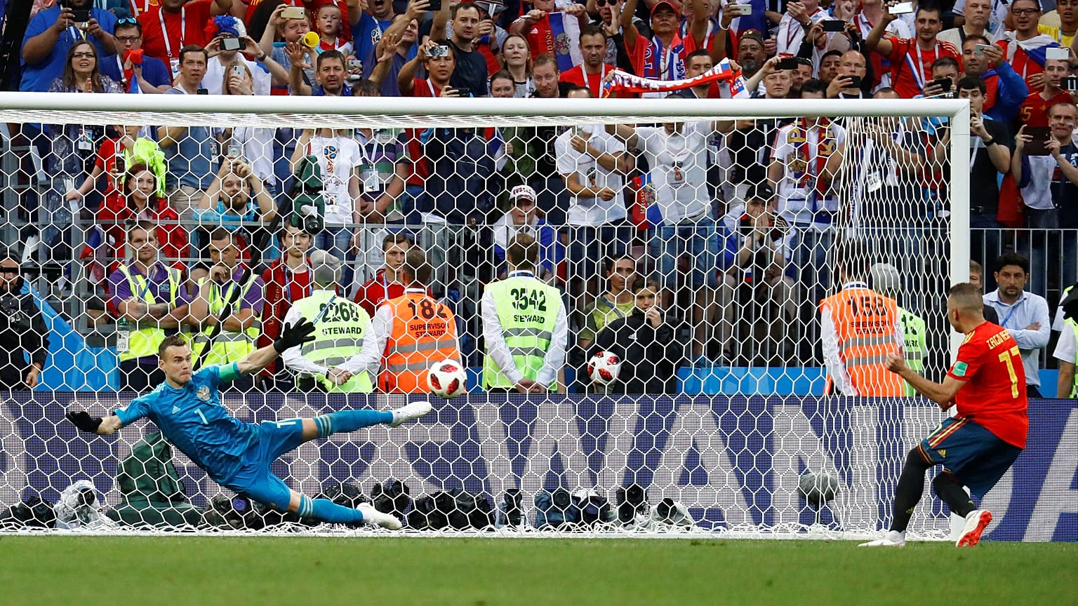 Last 16: Russia's Igor Akinfeev saves a penalty from Spain's Iago Aspas
