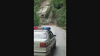 Huge landslide cuts off road in southwest China