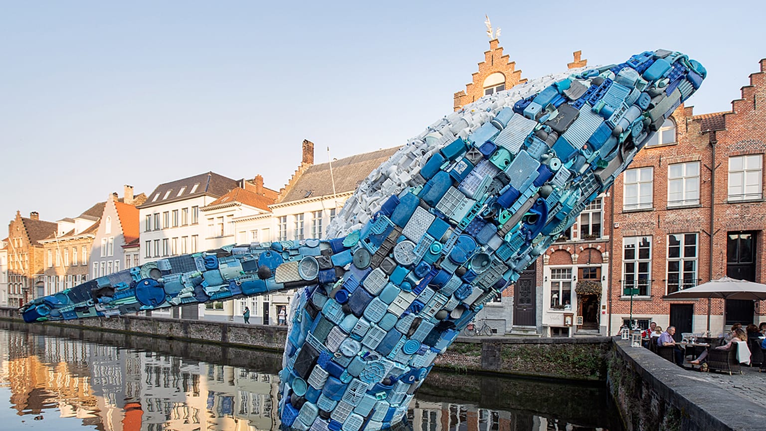Five tonnes of plastic waste from the sea is transformed into a leaping 12 metre tall whale in Belgium's Bruges canal