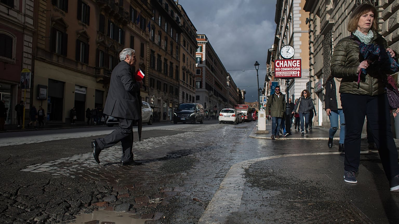 Rome residents paint potholes to alert cyclists and shame authorities after woman's death