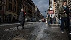 Rome residents paint potholes to alert cyclists and shame authorities after woman's death