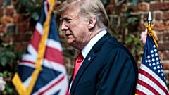 Donald Trump heads to a meeting with Theresa May in Britain on July 13